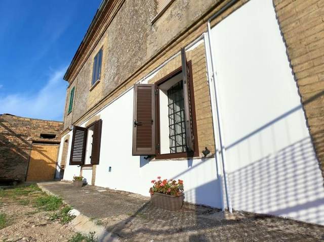 Exterior of the stone farmhouse